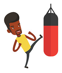 Image showing Man exercising with punching bag.