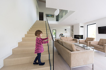 Image showing family with little girl enjoys in the modern living room