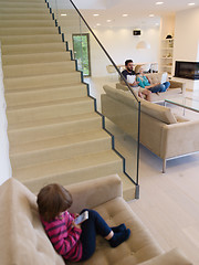 Image showing family with little girl enjoys in the modern living room