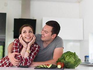 Image showing Young couple in the kitchen