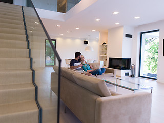 Image showing young happy couple relaxes in the living room