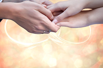 Image showing Wedding couple holding hands