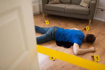 Image showing dead man body in blood on floor at crime scene