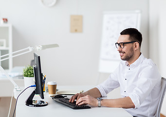 Image showing businessman typing on computer keyboard at office