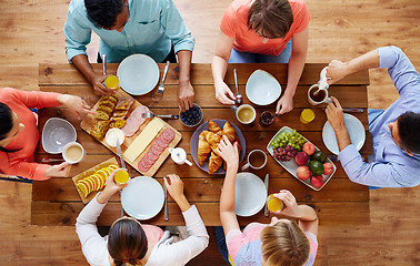 Image showing group of people having breakfast at table