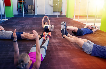 Image showing group of people exercising in gym