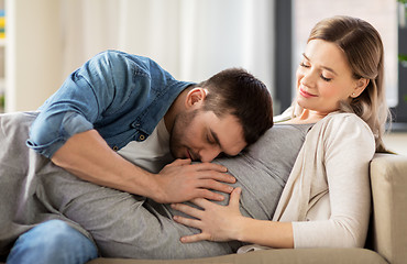 Image showing happy man with pregnant woman at home