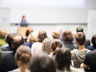 Image showing Woman giving presentation in lecture hall at university.