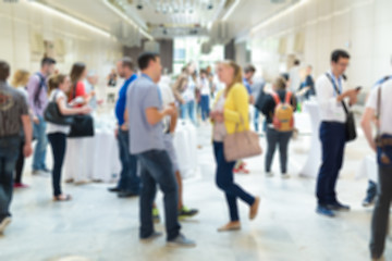 Image showing Blured image of businesspeople at coffee break at conference meeting.