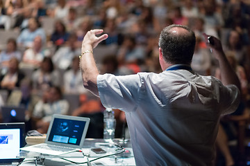 Image showing Public speaker giving talk at Business Event.