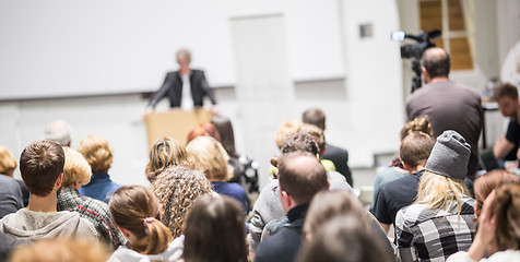 Image showing Business speaker giving a talk at business conference event.