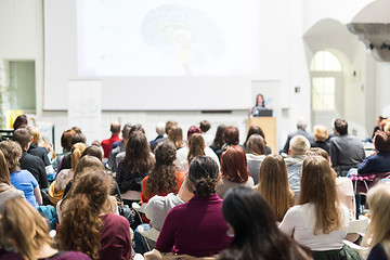 Image showing Woman giving presentation in lecture hall at university.