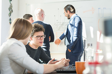 Image showing Relaxed informal IT business startup company team meeting.