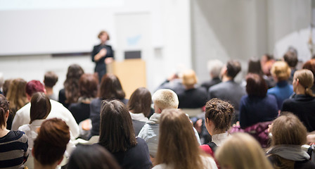 Image showing Woman giving presentation in lecture hall at university.