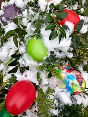 Image showing Easter eggs and decoration in snow