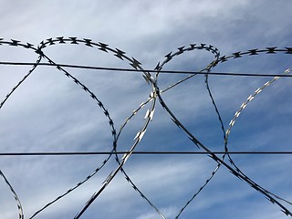 Image showing Barbed wire and sky