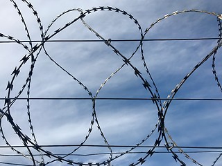 Image showing Barbed wire and sky