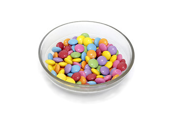 Image showing Bright colorful candy in bowl on white background