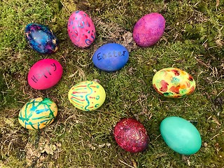 Image showing Happy Easter - Colourful Easter eggs in green moss.