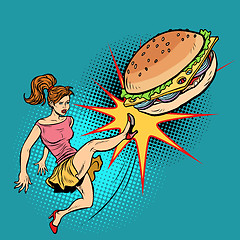 Image showing Woman kicks Burger, fastfood and healthy food