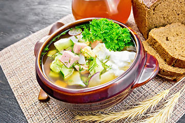 Image showing Okroshka in clay bowl on board