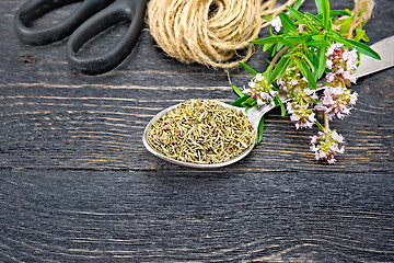 Image showing Thyme dry in spoon with twine on board