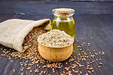 Image showing Flour linen in bowl with oil and seeds on board