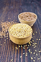 Image showing Flaxen white and brown seed in bowl on board