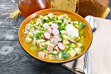 Image showing Okroshka in bowl with napkin on black board