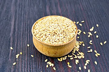 Image showing Flaxen white seed in bowl on dark board