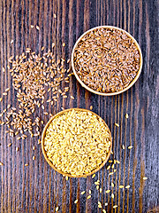 Image showing Flaxen white and brown seed in bowl on board top