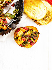 Image showing Bruschetta with chard and orange on board top