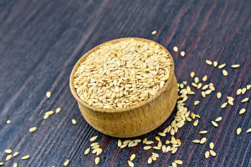 Image showing Flaxen white seed in bowl on board