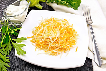 Image showing Salad of carrot and kohlrabi in white plate on board