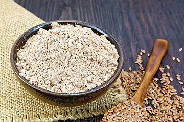 Image showing Flour linen in bowl with seeds in spoon on sacking