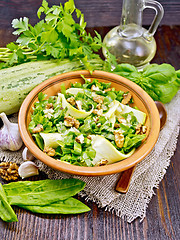 Image showing Salad with squash and sorrel on dark board