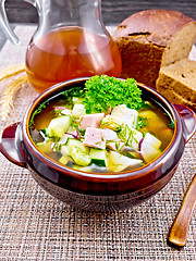 Image showing Okroshka in clay bowl on wicker napkin