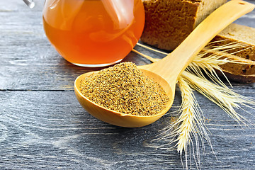 Image showing Malt in spoon on wooden board