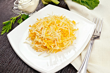 Image showing Salad of carrot and kohlrabi in plate on board