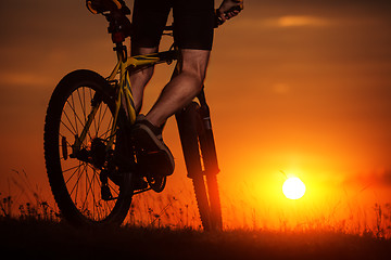 Image showing Silhouette of a bike on sky background