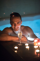 Image showing man relaxing in the jacuzzi