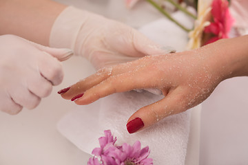 Image showing Woman hands receiving a manicure