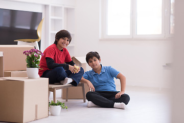 Image showing boys with cardboard boxes around them