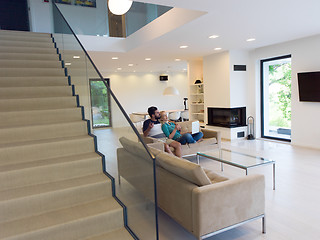 Image showing young happy couple relaxes in the living room