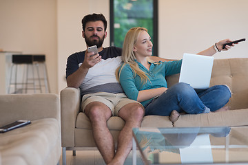 Image showing young happy couple relaxes in the living room