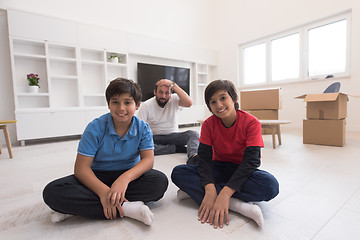 Image showing portrait of happy young boys with their dad