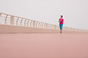 Image showing woman busy running on the promenade