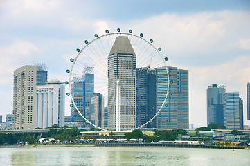 Image showing Singapore Ferries Wheel and skyscrapers