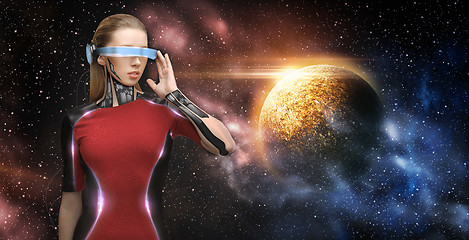 Image showing female robot in virtual reality glasses over space