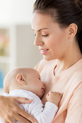 Image showing close up of mother holding sleeping baby